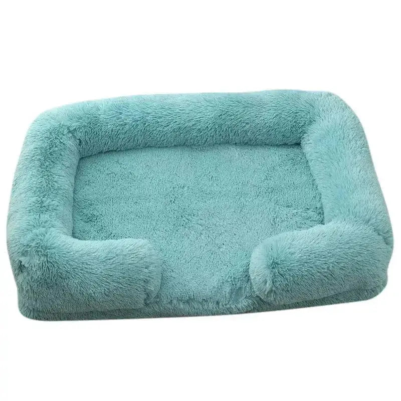 Photographie d’un lit moelleux pour chien avec bords confortables, en turquoise