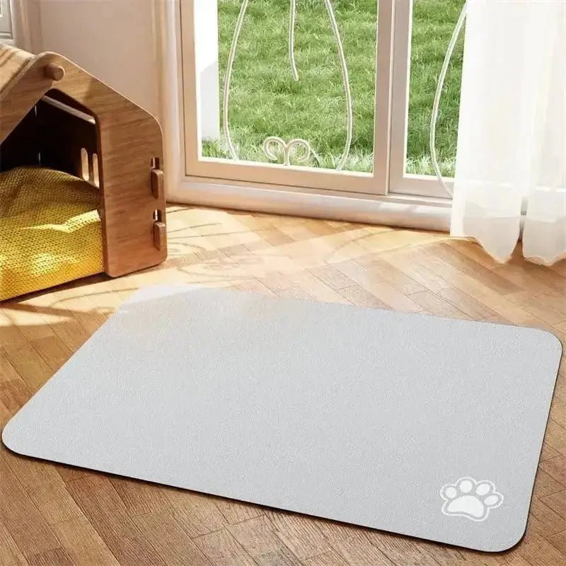 Tapis sous gamelle pour chien antidérapant et absorbant avec empreintes de pattes blanches