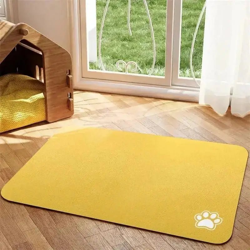 Tapis de protection sous gamelle pour chien jaune avec empreintes de pattes, antidérapant et facile à nettoyer