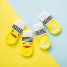 Chaussettes antidérapantes pour chien avec motif jaune, face de canard et grip paw print