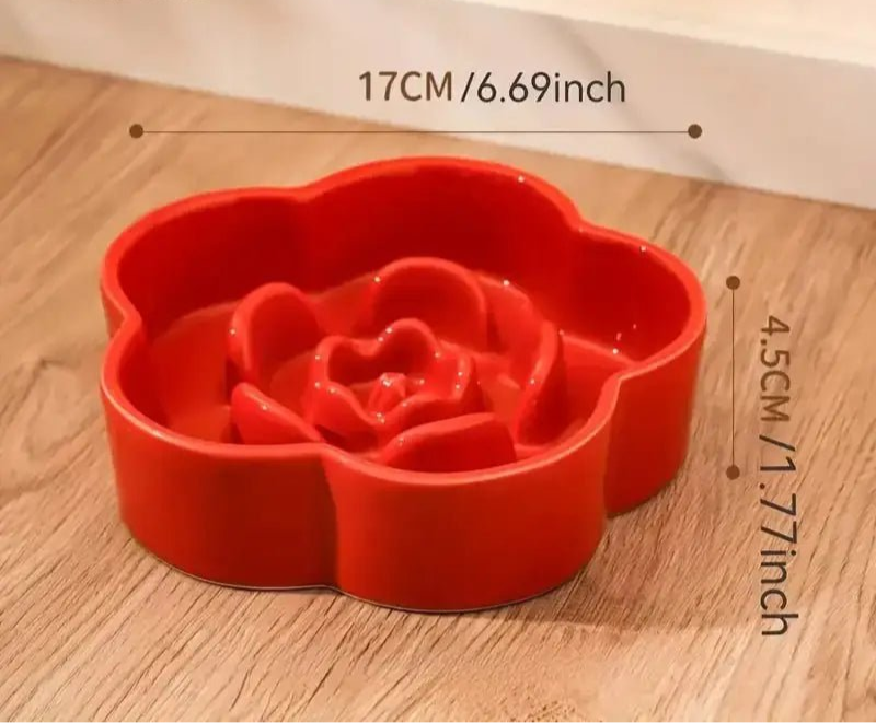 Vignette d’une gamelle céramique anti-glouton pour chien en forme de fleur rouge