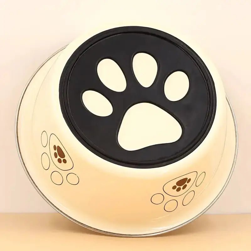 Photographie d’une gamelle en inox pour chien antidérapante avec motif de patte décorative