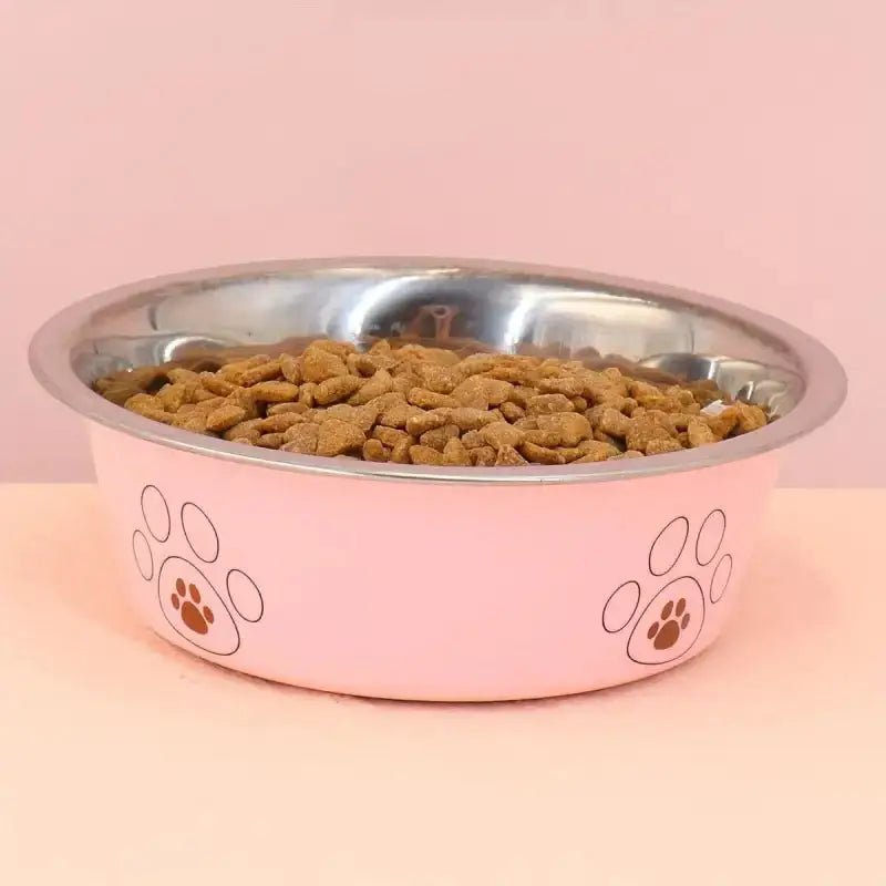 Gamelle en inox pour chien antidérapante avec logo patte, remplie de croquettes