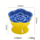Photo d’une gamelle anti glouton surélevée en céramique pour chien fleur en céramique sur pied