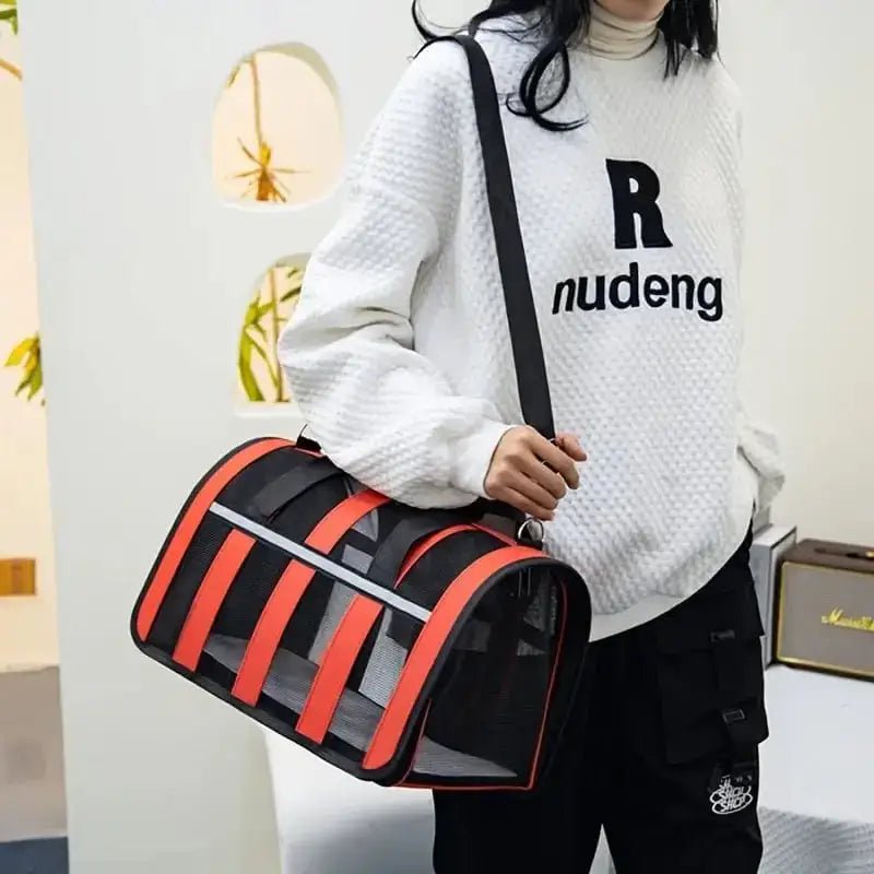 Sac rigide ventilé pour chien petit et léger en orange et noir, avec fermetures zippées