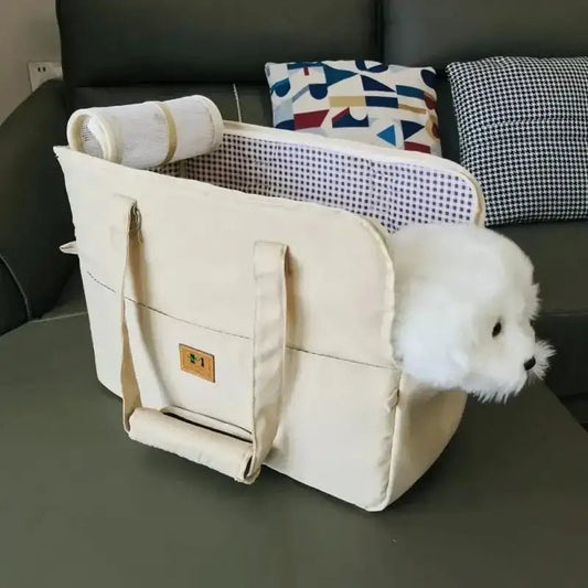 Sac de transport rembourré pour chien beige avec un chien blanc à l’intérieur